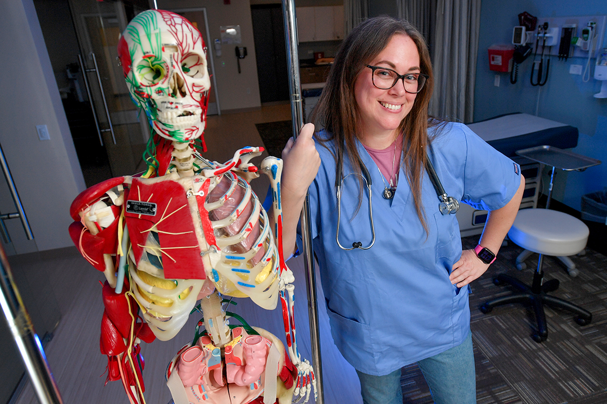 Katherine Moore with a musculoskeleton model